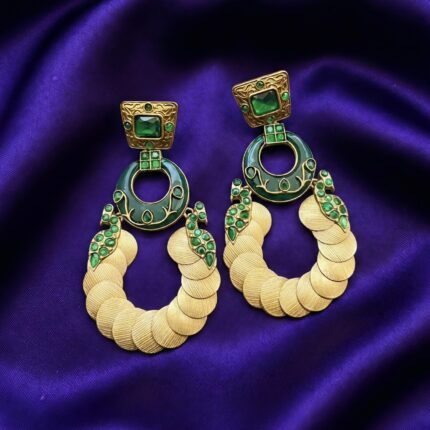 Amber color Gold Coin Design Rajwadi Chandbali Earrings placed on blue silk cloth