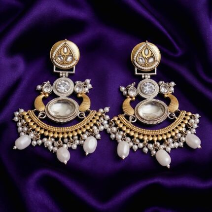 Fusion Chandbali Earrings with Translucent Stone & Diamond placed over blueish purple silk cloth