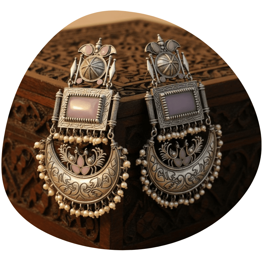 A pair of silvered oxidized chandbali design earrings