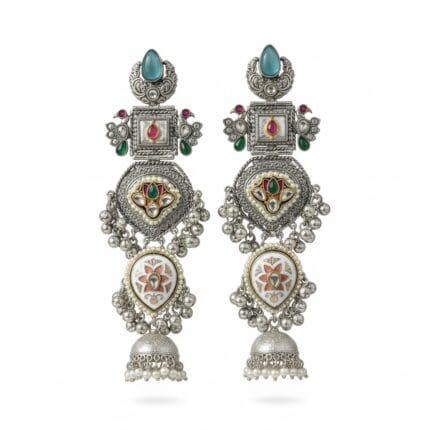a pair of long silver plated traditional Kundan Chandbali Jhumka earrings with blue, pink, and green artificial stones placed on a plain white background