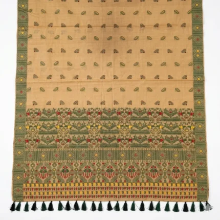 Full View of beige bamboo cotton saree with green woven border and dark green tassels.